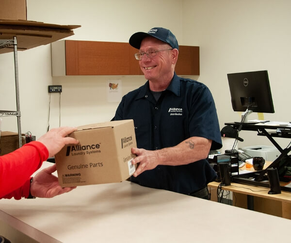 employee handing off a small package